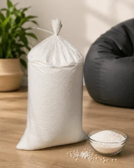 High density bean bag refill 1 kg pack filled with premium virgin EPS beans placed beside a bean bag chair.