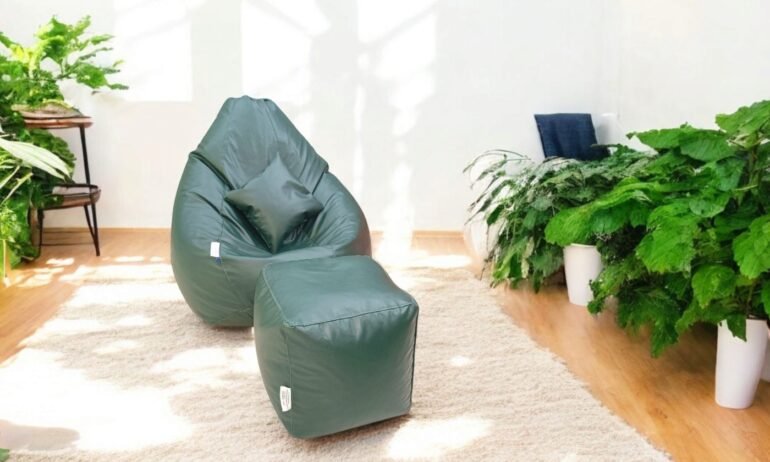 Premium Green Leather Bean Bag Chair with Footrest in Modern Indoor Living Space Surrounded by Lush Green Plants